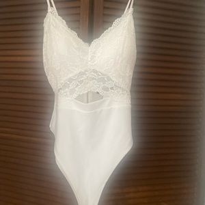 Lace cut out body suit size large